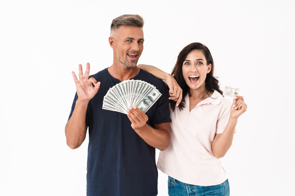 picture-emotional-surprised-adult-loving-couple-isolated-white-wall-holding-money-credit-card